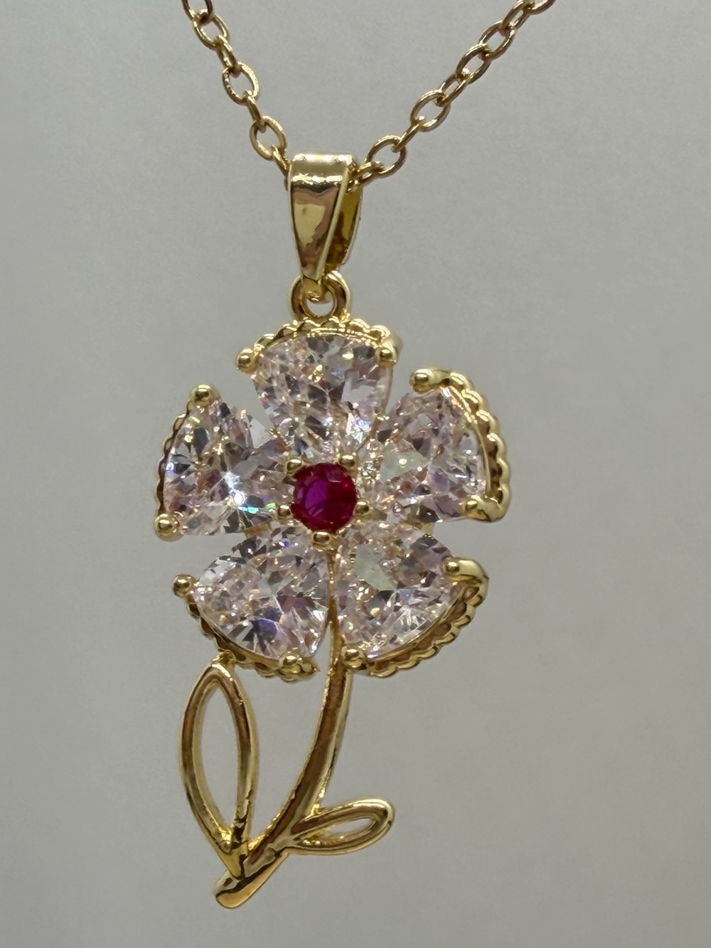 Gold-Tone Floral Pendant Necklace with Pink Crystal Petals and Red Center
